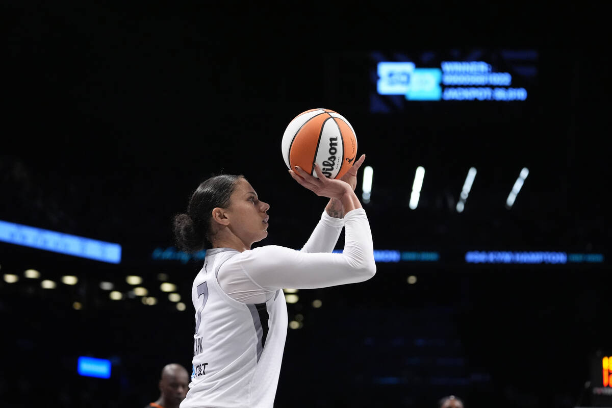 Las Vegas Aces' Alysha Clark (7) shoots a three-point shot during the second half of a WNBA bas ...