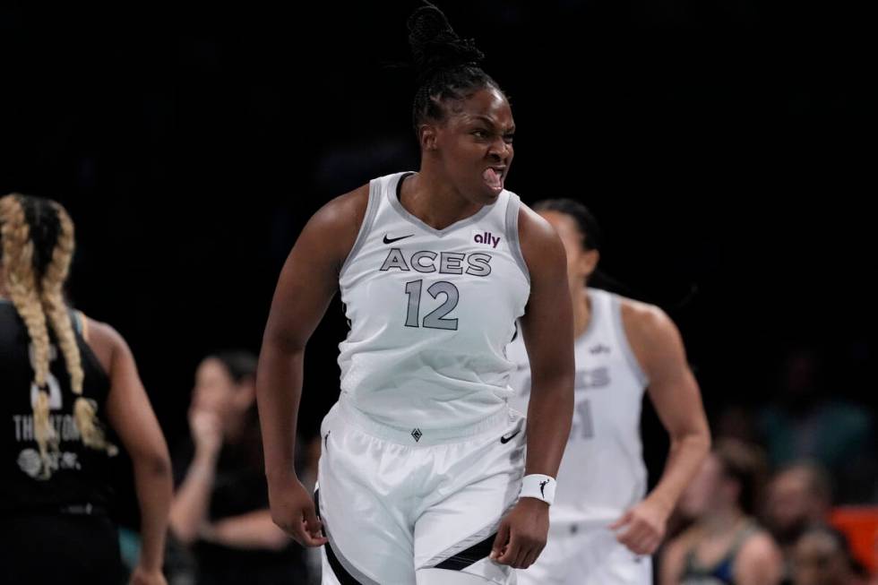 Las Vegas Aces' Chelsea Gray (12) gestures after scoring during the first half of a WNBA basket ...