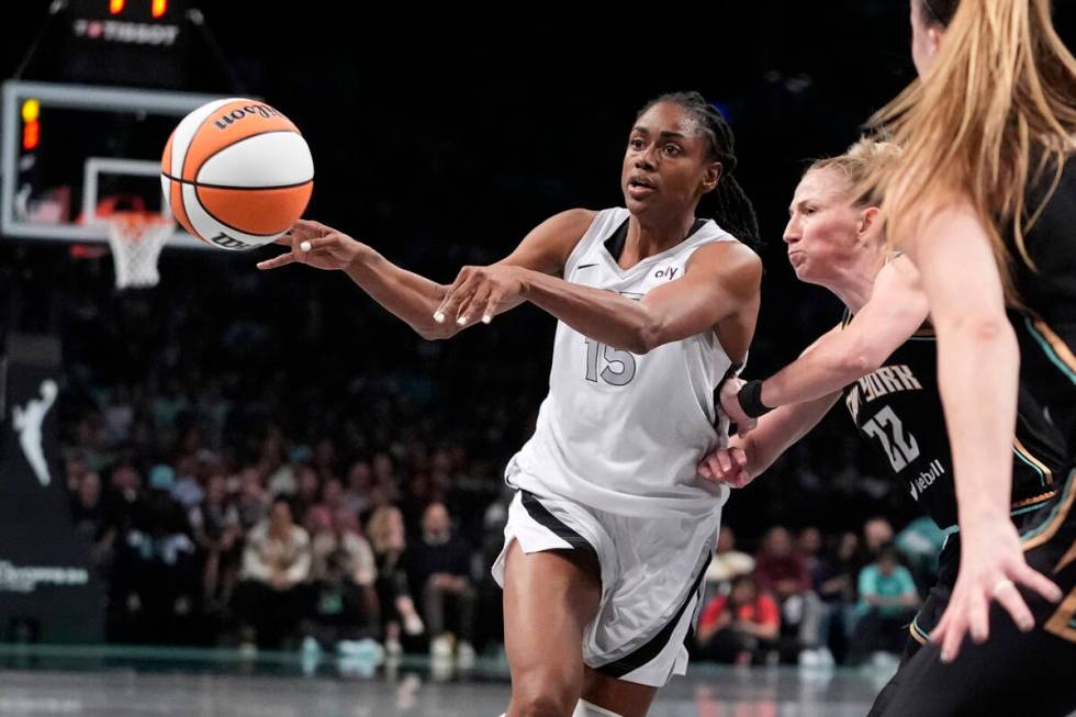 Las Vegas Aces' Tiffany Hayes (15) passes away from New York Liberty's Courtney Vandersloot (22 ...