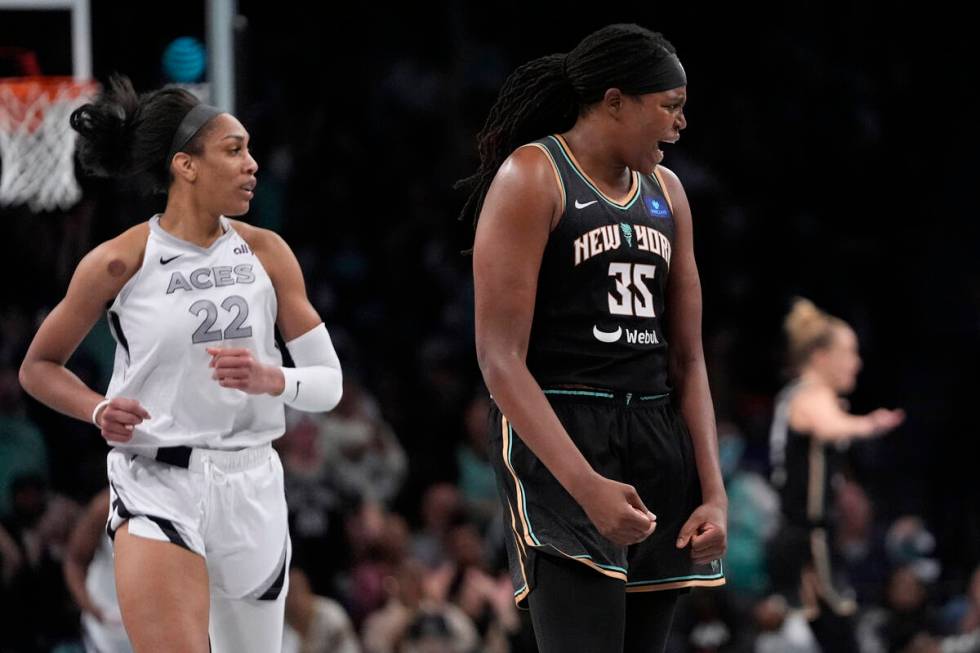 New York Liberty's Jonquel Jones (35) celebrates after making a three-point shot as Las Vegas A ...