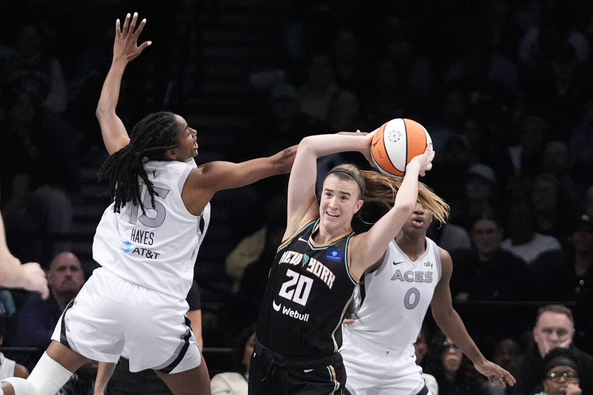 New York Liberty's Sabrina Ionescu (20) passes away from Las Vegas Aces' Tiffany Hayes (15) and ...