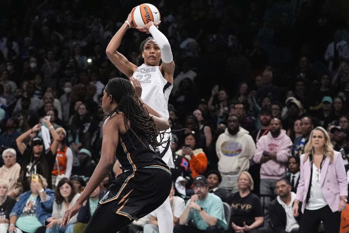 Las Vegas Aces' A'ja Wilson shoots over New York Liberty's Jonquel Jones during the second half ...