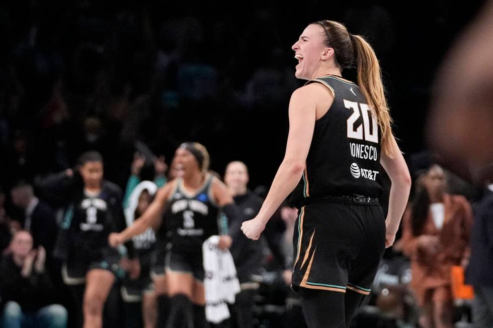 New York Liberty's Sabrina Ionescu (20) celebrates after a WNBA basketball semifinal game again ...