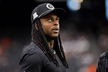 Las Vegas Raiders wide receiver Davante Adams looks on before an NFL football game between the ...