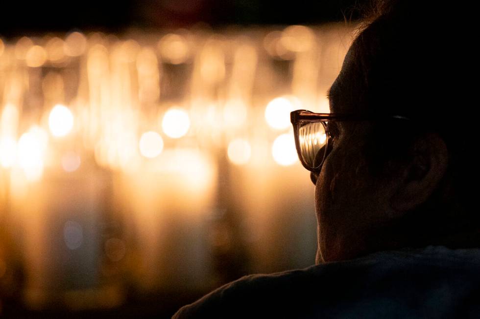 A mourner attends the candlelight vigil to remember those who perished during the events of Oct ...