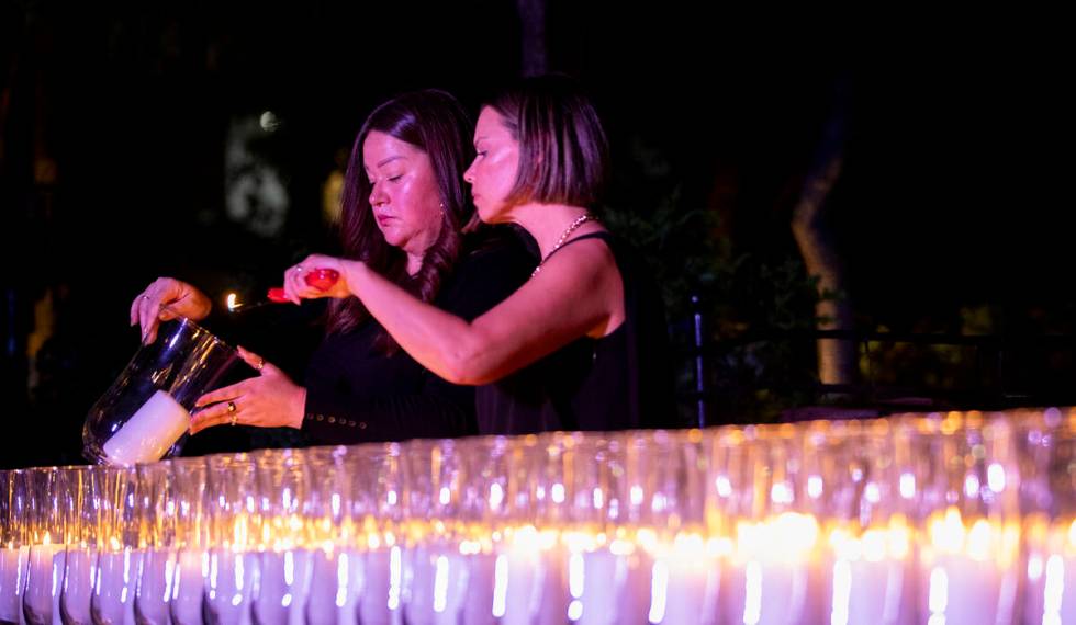 A candle is lit to remember each of the 58 victims who perished during the events of Oct. 1, 20 ...