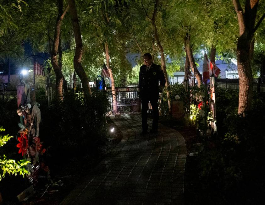 Las Vegas Fire and Rescue Senior Deputy Fire Chief Robert Nolan walks along a path lined with r ...