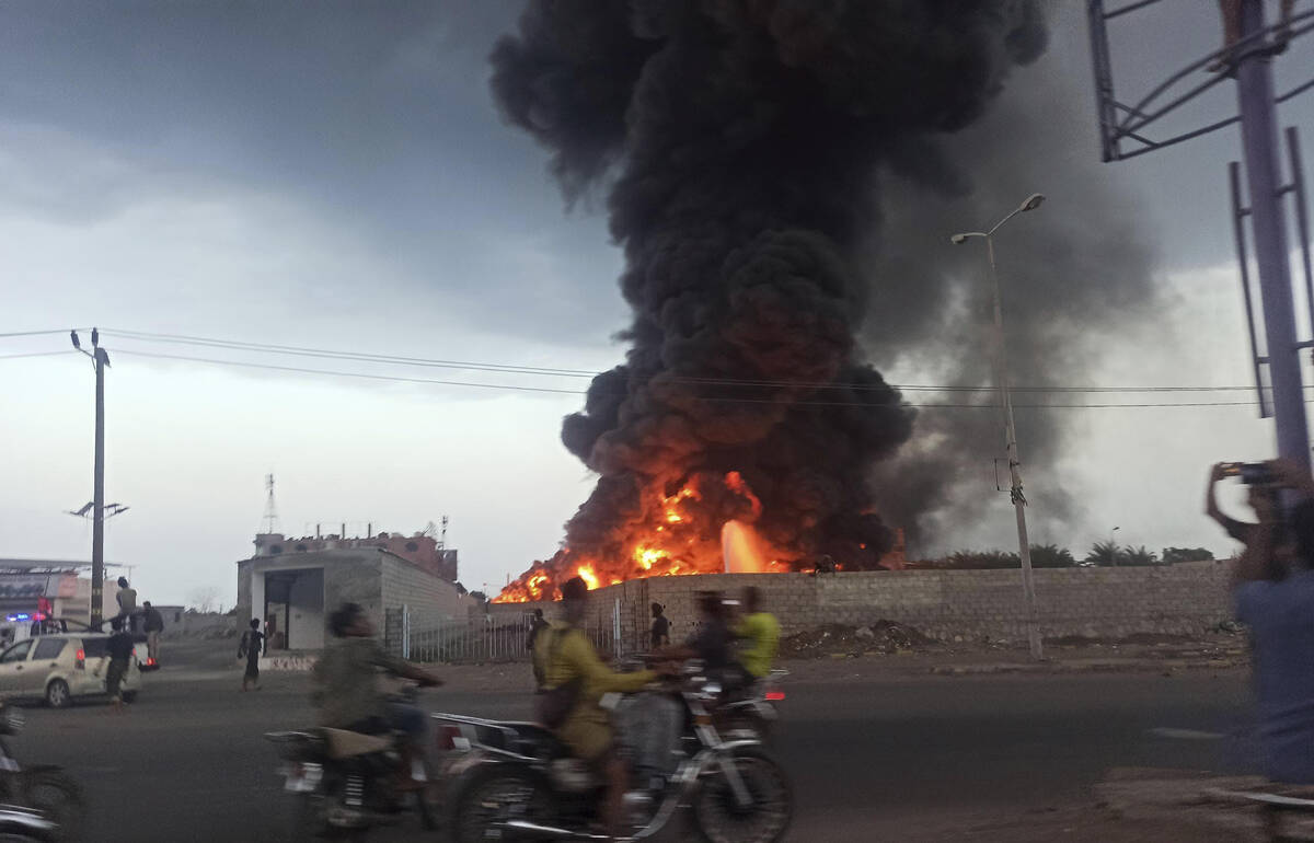 A large fire and plume of smoke is visible in the port city of Hodeida, Yemen, on Sunday, Sept. ...