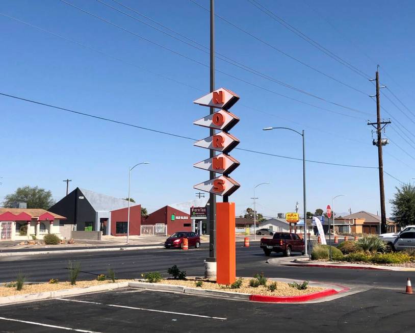 The signature stacked sawtooth pennant sign of Norms diner that appears to be nearing completio ...