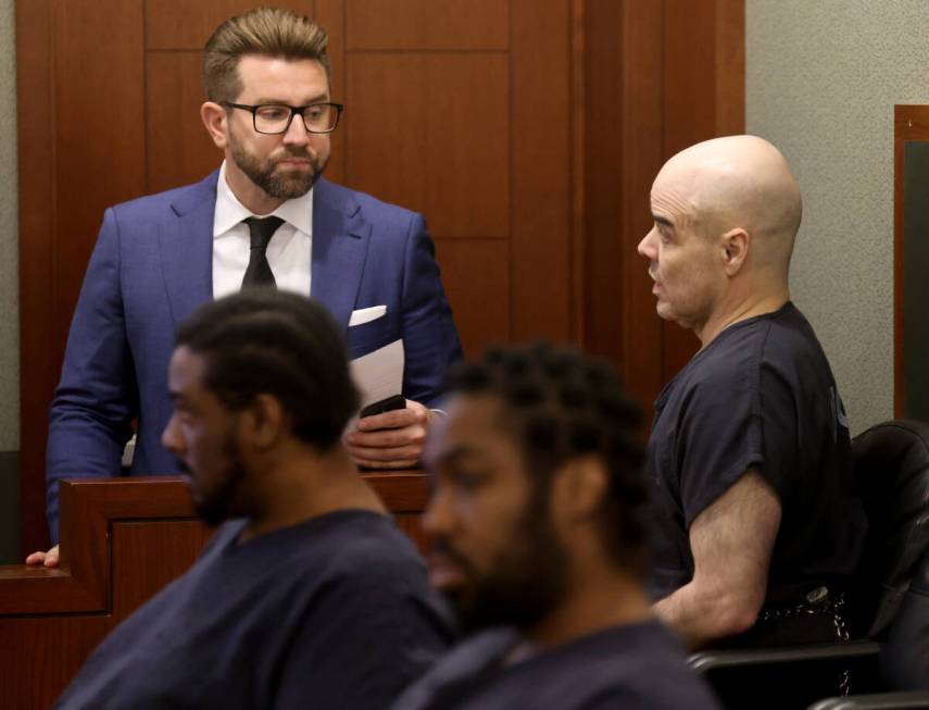 Robert Telles, right, talks to one of his attorneys, Michael Horvath, in the courtroom before a ...