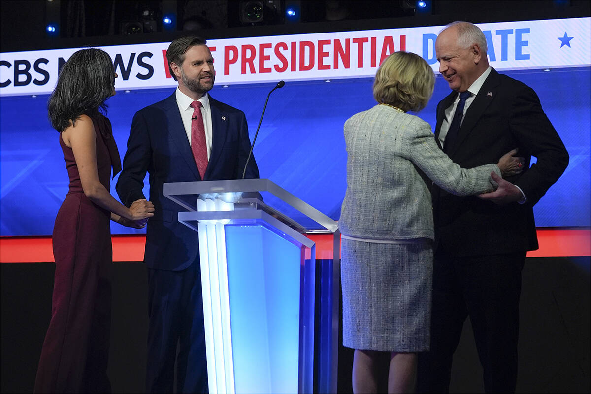 Republican vice presidential nominee Sen. JD Vance, R-Ohio, and his wife Usha Vance and and Dem ...