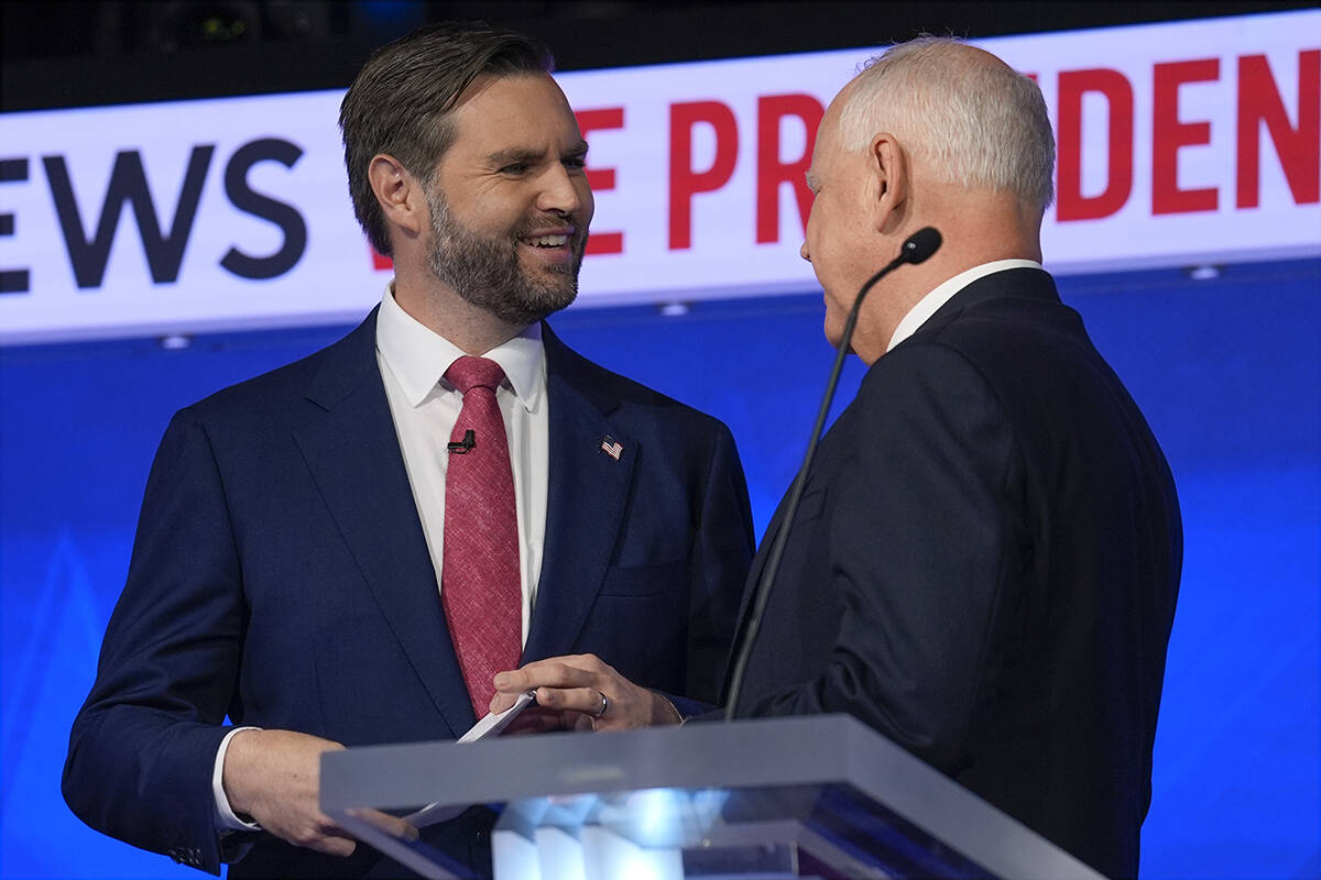 Republican vice presidential nominee Sen. JD Vance, R-Ohio, talks with Democratic vice presiden ...