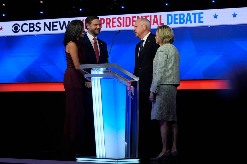 Republican vice presidential nominee Sen. JD Vance, R-Ohio, and his wife Usha Vance talk with D ...