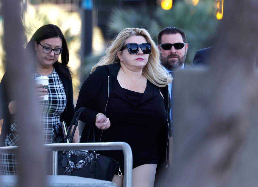 Former Las Vegas City Councilwoman Michele Fiore, center, arrives for her wire fraud trial at t ...