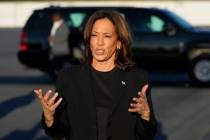 Democratic presidential nominee Vice President Kamala Harris speaks to reporters before boardin ...