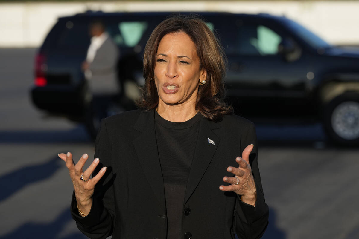 Democratic presidential nominee Vice President Kamala Harris speaks to reporters before boardin ...