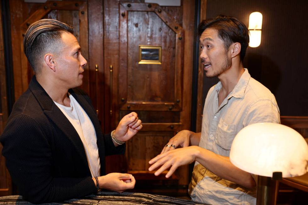 Kent Yoshimura, co-founder and CEO at NeuroGum and Mints, right, talks with former Olympic cham ...