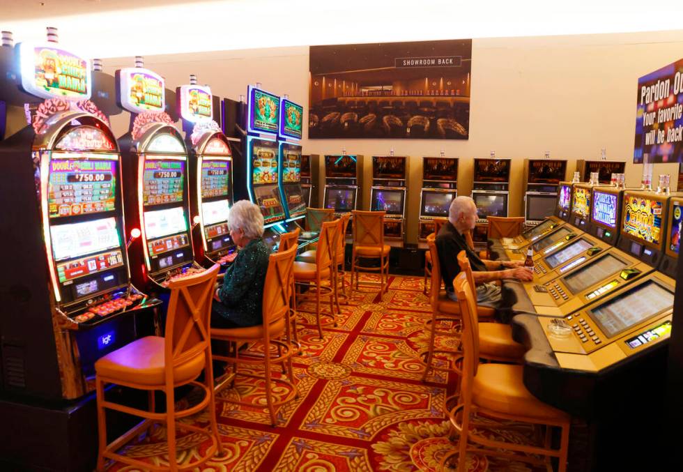 Patrons gamble at the CasaBlanca hotel-casino as construction is underway on the Showroom, cent ...