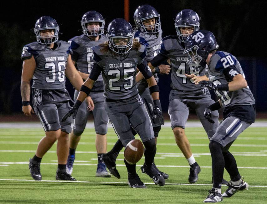 Shadow Ridge players watch a punt come to a stop during the high school football game against F ...