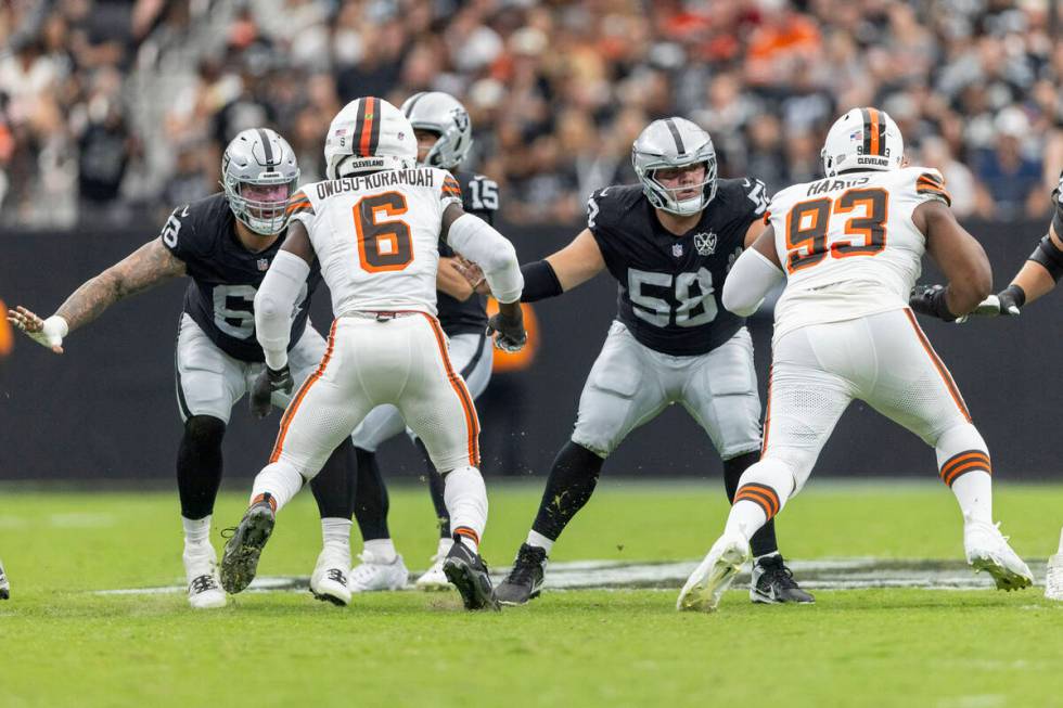 Raiders center Andre James (68) and guard Jackson Powers-Johnson (58) protect the pocket agains ...