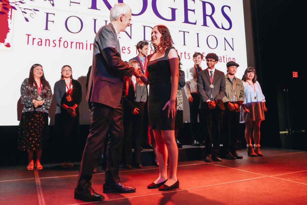 Jana Alnajjar, left, receives a $100,000 college scholarship from The Rogers Foundation at The ...