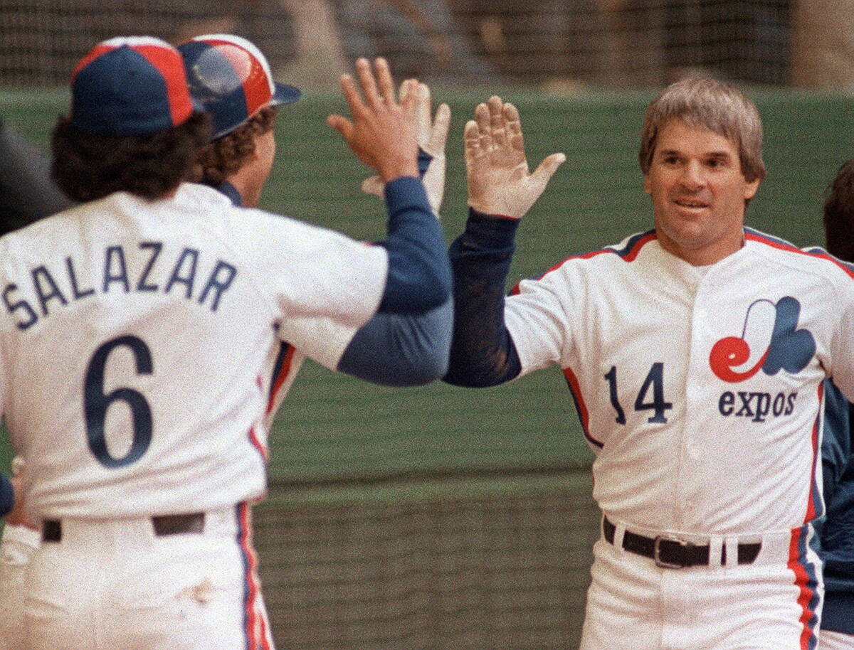 Montreal Expos Pete Rose celebrates his 4,000th career hit with teammates against the Philadelp ...