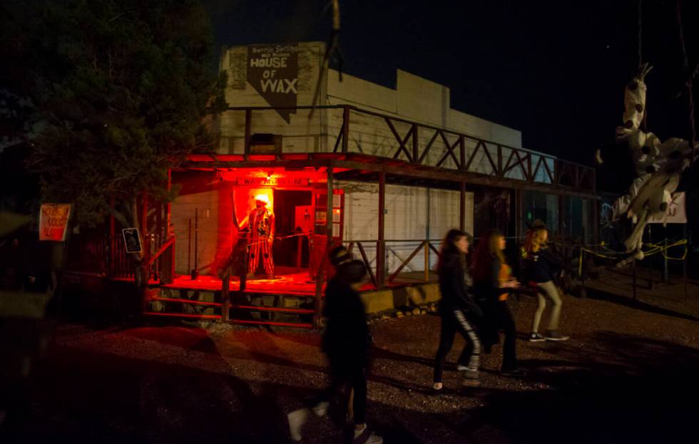 People pass by an attraction during "Bonnie Screams" at Bonnie Springs Ranch outside of Las Veg ...