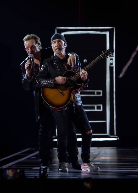 Bono, left, and The Edge perform "Tryin' to Throw Your Arms Around the World" during U2's Spher ...