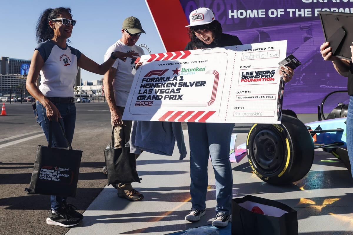 Gabrielle Lowe, 16, holds her ticket to the Formula One Las Vegas Grand Prix before taking a be ...