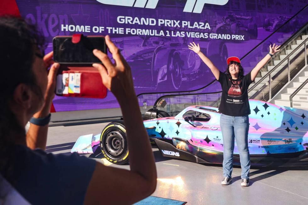 Giselle Lowe takes a photo of her daughter Gabrielle Lowe, 16, with Formula One Las Vegas Grand ...