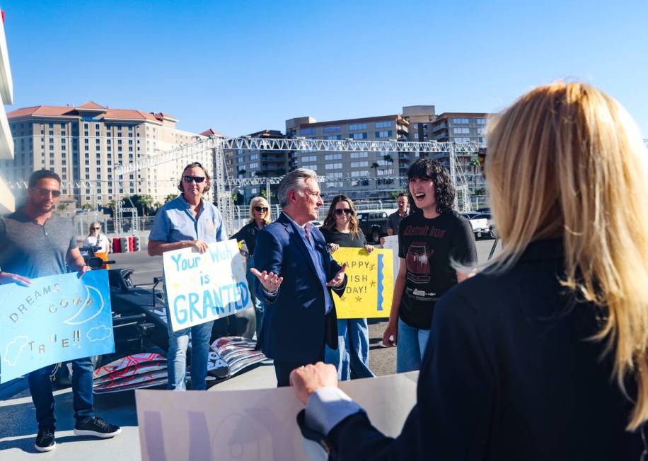 Gabrielle Lowe, 16, is greeted by Make-A-Wish Southern Nevada CEO Scott Rosenzweig at the F1 Gr ...