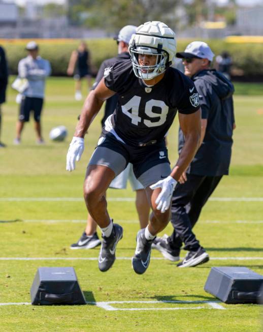 Raiders defensive end Charles Snowden (49) leaps over a pad during the first day of Raiders tra ...