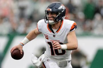 Denver Broncos quarterback Bo Nix (10) looks to pass during an NFL football game against the Ne ...