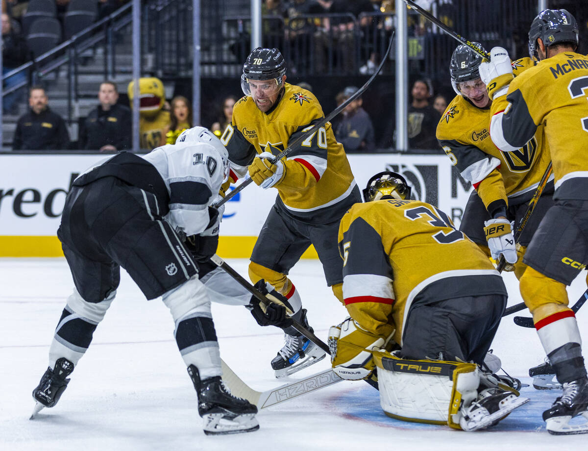 Golden Knights forward Tanner Pearson (70) charges in to defend Golden Knights goaltender Ilya ...