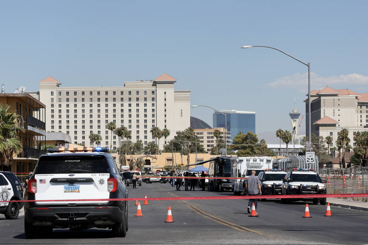 Las Vegas police investigate the scene of a officer-involved shooting on Deckow Lane near Tropi ...