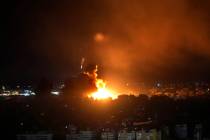 Flames rise from Israeli airstrikes in Dahiyeh, Beirut, Lebanon, Friday, Oct. 4, 2024. (AP Phot ...