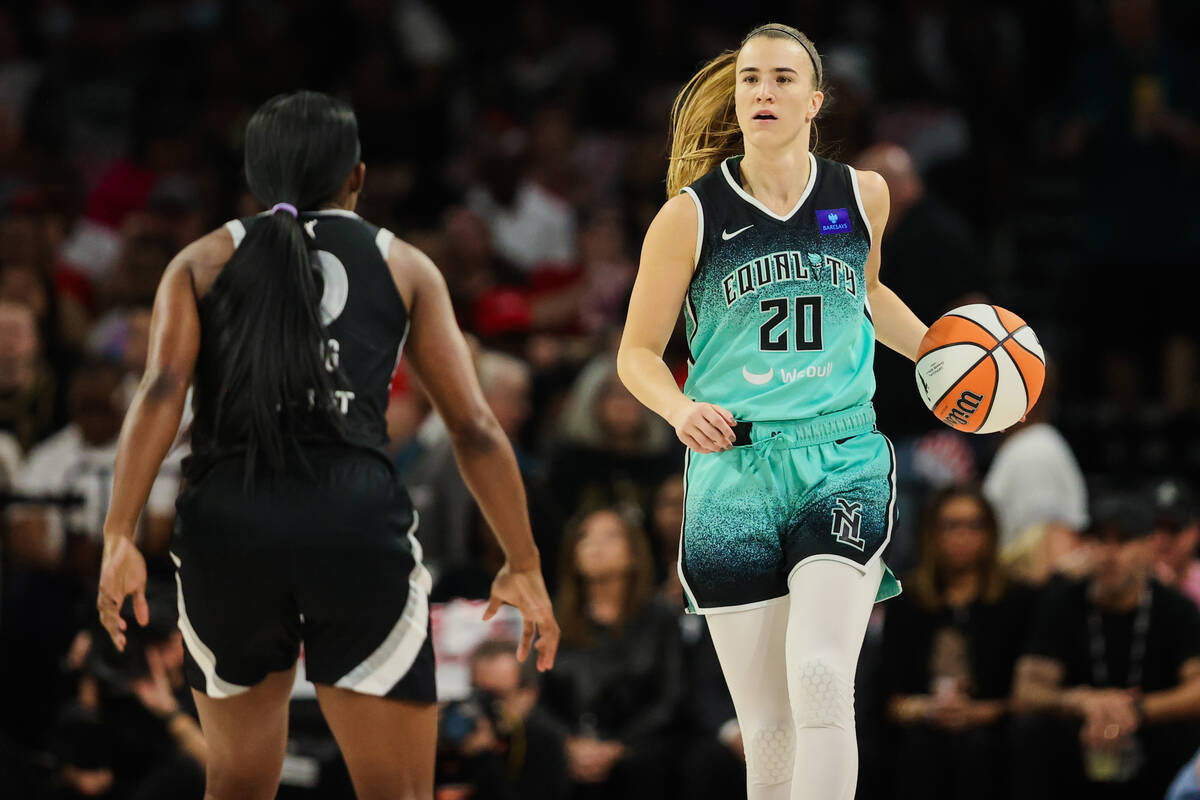 New York Liberty guard Sabrina Ionescu (20) dribbles the ball down the court as Aces guard Jack ...