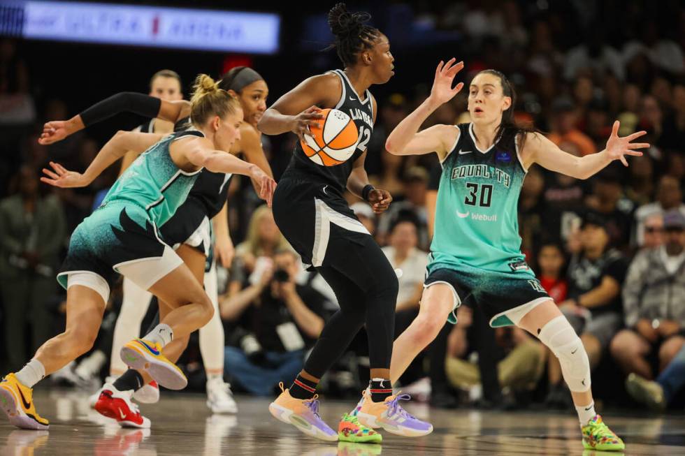 Aces guard Chelsea Gray (12) dribbles the ball as she looks for an open teammate during game th ...