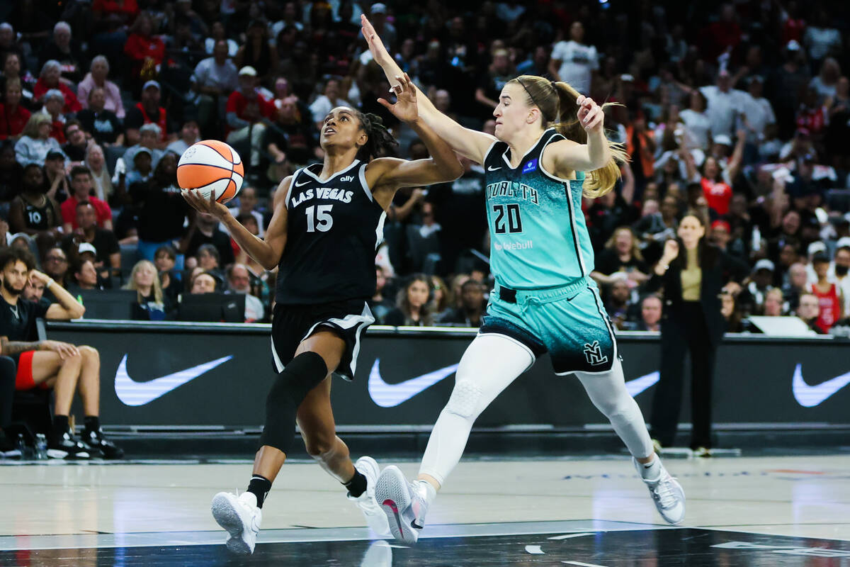 Aces guard Tiffany Hayes (15) drives the ball to the hoop as New York Liberty guard Sabrina Ion ...