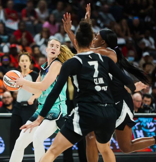 New York Liberty guard Sabrina Ionescu (20) looks for an open teammate as Aces defense escalate ...