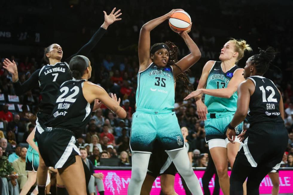 New York Liberty forward Jonquel Jones (35) grabs the ball as it comes down from the net during ...