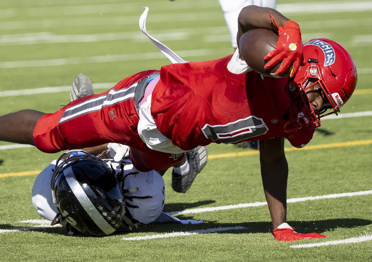 Arbor View running back Kamareion Bell (0) stretches for a first down during the high school fo ...