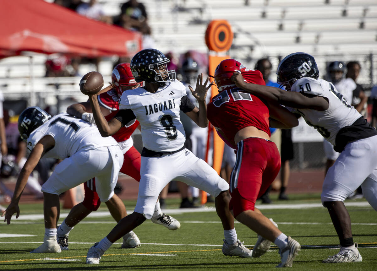 Desert Pines quarterback Zeyshawn Martin (8) looks to throw the ball during the high school foo ...