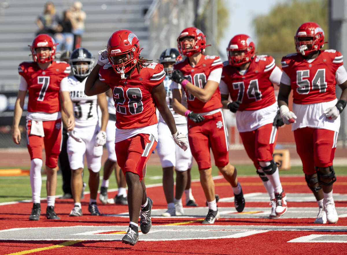 Arbor View running back Nylen Johnson (28) celebrates after scoring a touchdown during the high ...