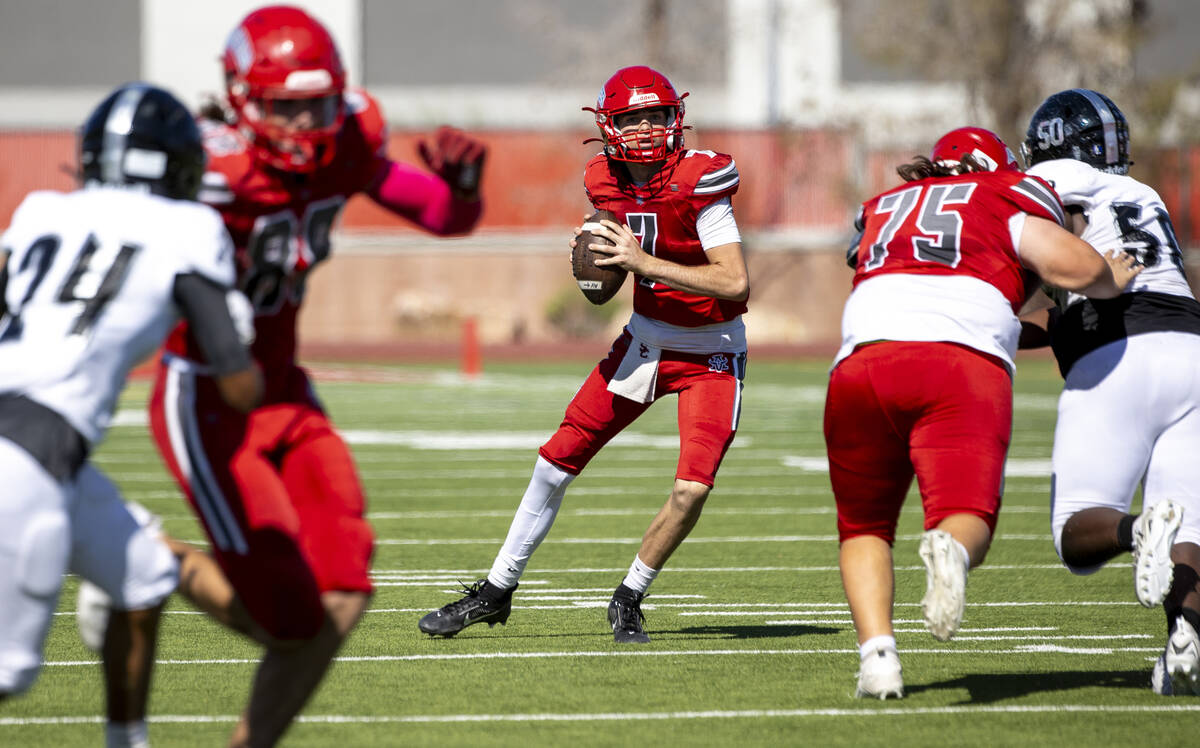 Arbor View quarterback Thaddeus Thatcher (7) looks to throw the ball during the high school foo ...