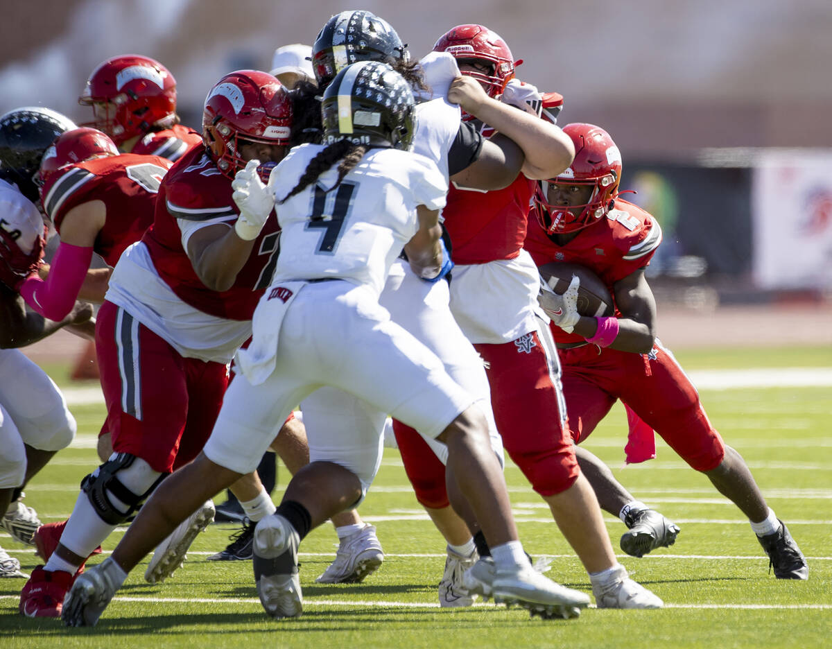 Arbor View running back Sean Moore (2) runs with the ball during the high school football game ...