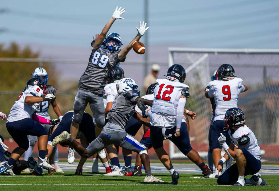 Basic defensive end Hunter McGory (89) attempts to block an extra point by Coronado kicker Tyle ...