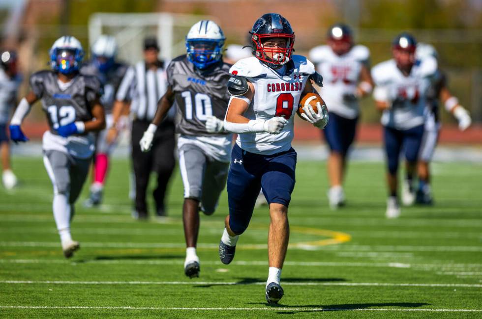 Coronado tight end Neville Roberts (8) sprints up the field after a reception with Basic safety ...