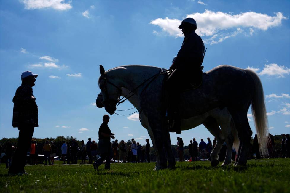 Mounted police watch as supporters arrive before Republican presidential nominee former Preside ...