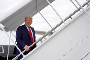 Republican presidential nominee former President Donald Trump boards his plane at West Palm Bea ...